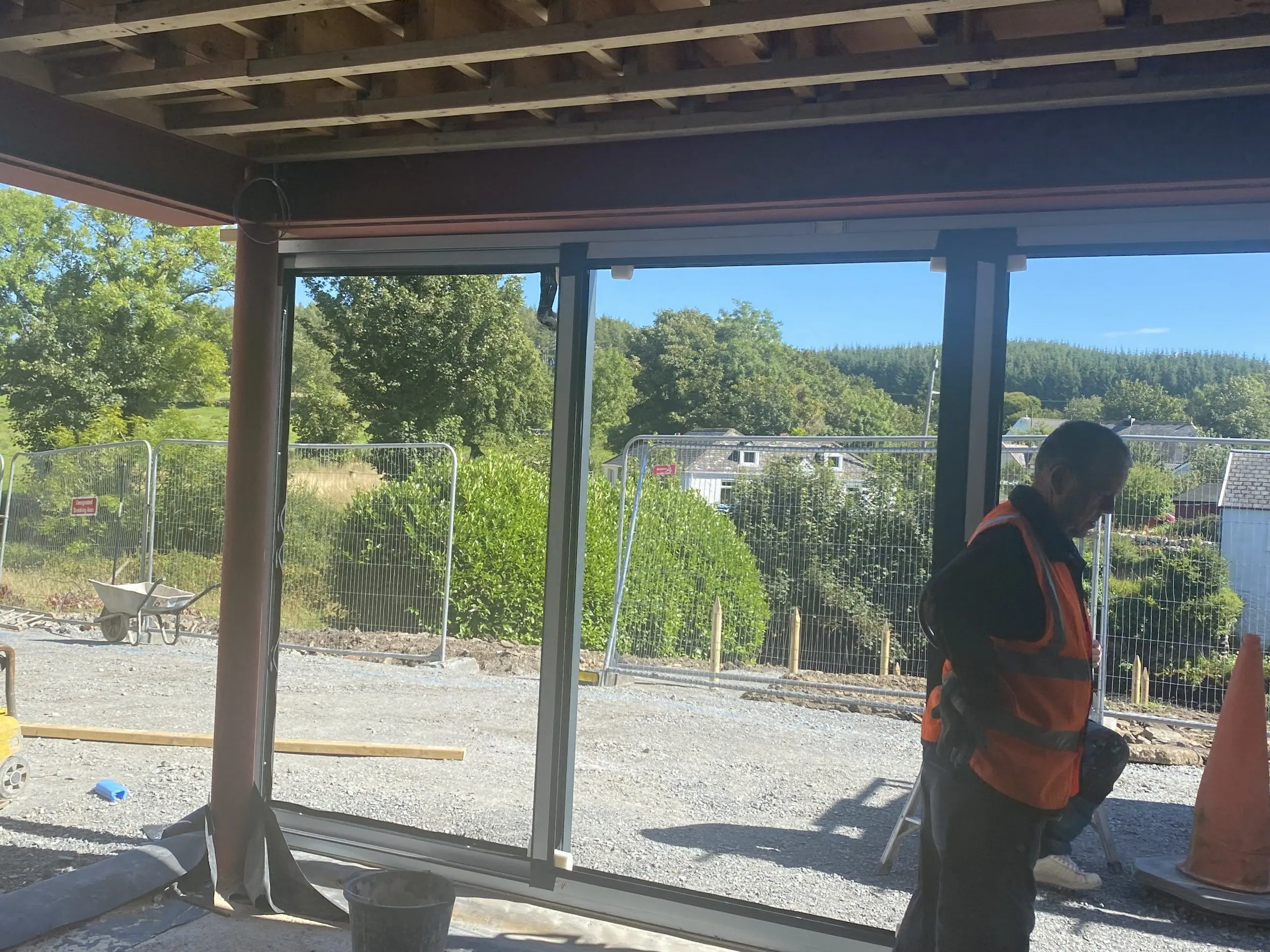 The frame of the new glass-fronted restaurant, looking out over the garden